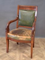 Fauteuil en acajou et placage d'acajou garni de cuir vert, l…