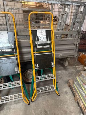 two carts that are next to each other in a warehouse