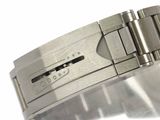 a close up of a watch bracelet on a white surface