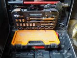 many tools in a tool case on the floor