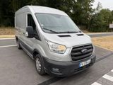 a silver van that is parked on the side of the road