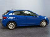 a blue car is parked in a room with a gray floor