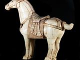 statue of a horse with a harness on it ' s back