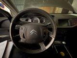 the interior of a car with a steering wheel and dashboard