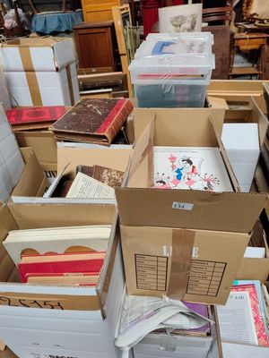 many boxes of books stacked on top of each other