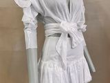 an image of a mannequin wearing a white dress