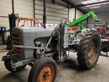 a tractor that is parked inside of a building