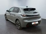 the rear end of a silver toyota corollant parked in a room