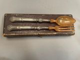 two spoons and a spoon rest on a book
