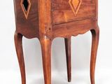 a small wooden table with a drawer on top of it