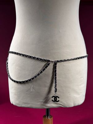 a mannequin torso with a chain belt attached to it