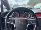 steering wheel of a car with gauges, gauges, and other instruments