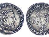 a close up of a coin with a crown on top of it