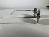 a pair of sunglasses sitting on a white surface