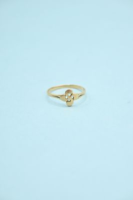 a gold ring with a small diamond on top of it