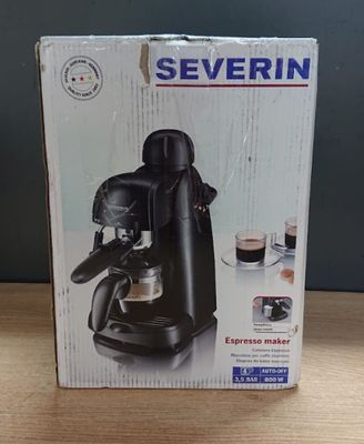 the box of the coffee maker is sitting on the table