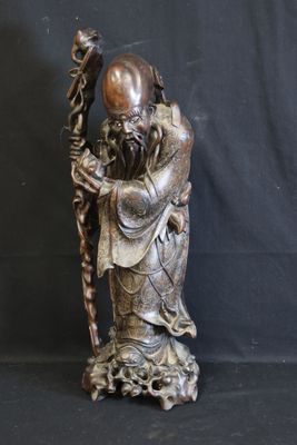 chinese bronze statue of a man holding a staff and a bird