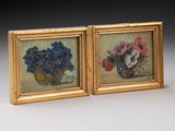 two framed paintings of flowers in a vase on a table
