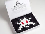 an image of a white box with a red and black pixel design