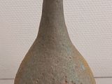 a small vase that is sitting on a table