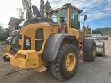 a picture of a large construction vehicle parked in a lot