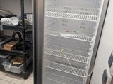 an image of a refrigerator in a kitchen with the door open