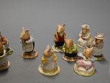 many figurines of mice that are sitting on a table