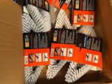 a box full of cleaning brushes and a pair of scissors