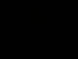 a man that is standing in the dark with a cell phone