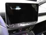 a picture of a car dashboard with a flat screen tv