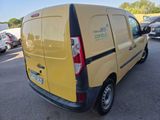 a yellow van that is parked in a parking lot