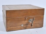 a small wooden box with a handle on it