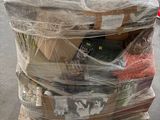 a large pile of items wrapped in plastic on the floor