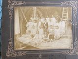 an old photo of a group of people posing for a picture