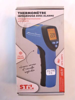 an image of a blue and black digital thermometer in a box