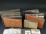 an assortment of old books sitting on top of a blue table