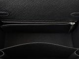 the inside of a black purse with a zipper on it