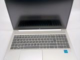 an open laptop computer sitting on top of a white table