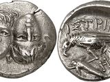 a silver coin with a man and a woman on it