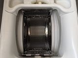 a white toilet with a black seat and a black lid