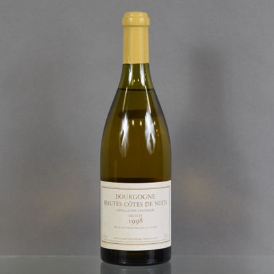 a bottle of wine that is sitting on a table