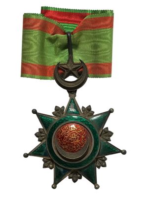 l'image d'une médaille portant une étoile