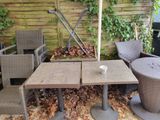 two chairs and a table in the backyard