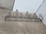 an image of a rack with a bunch of bikes on it