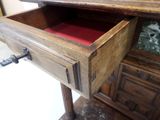 a wooden desk with a drawer on top of it