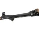 an old gun with a wooden handle on a white background