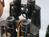 a lot of different types of binoculars on the table
