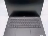 an open laptop computer sitting on top of a white table