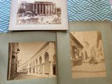 two old photos of a building and a car are on a bed