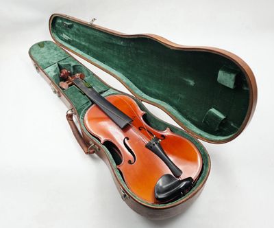 violin case with a violin in it on a white surface